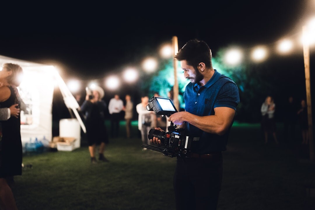 Mobile camera crew filming a live outdoor event