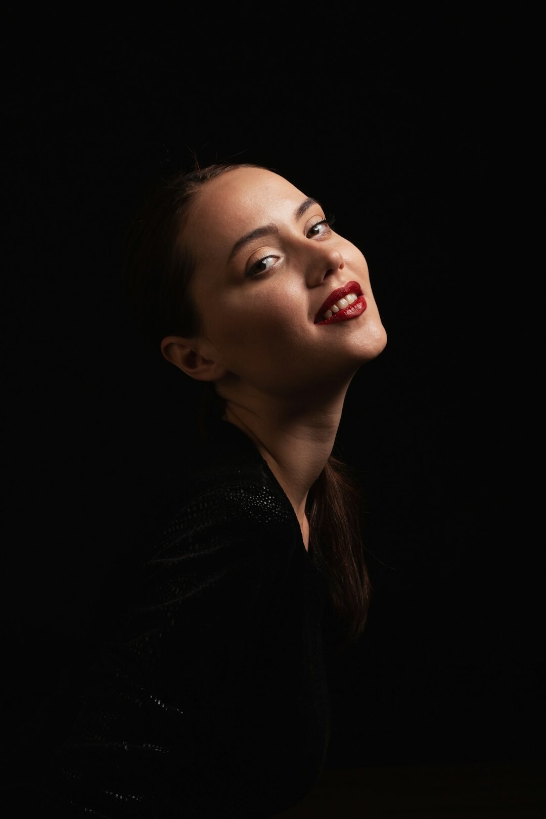 Studio portrait of a young woman smiling