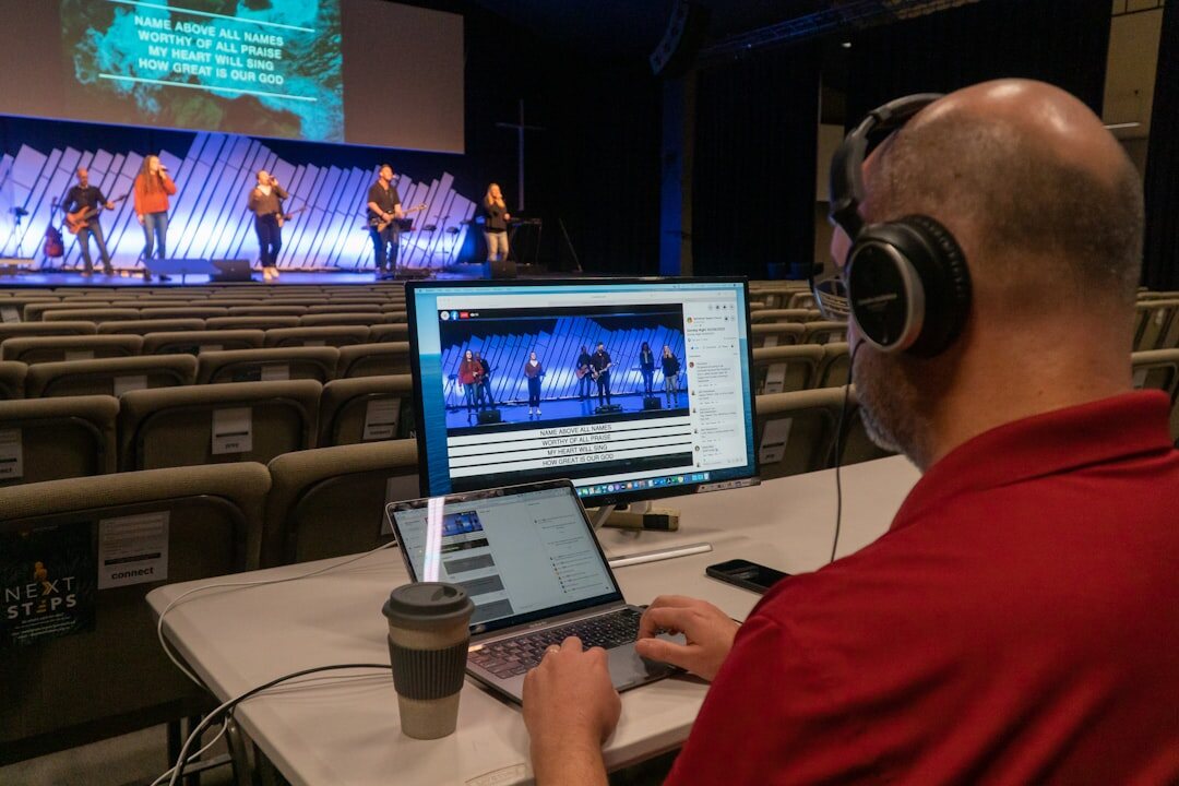 Broadcast control room with multiple video monitors and technicians